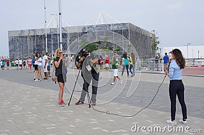 Interview in front of The Olympic Aquatics Stadium Editorial Stock Photo