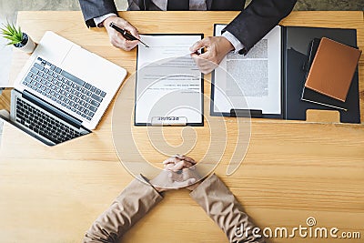 Interviewer or Board reading a resume during a job interview, Employer interviewing a young female job seeker for recruitment Stock Photo