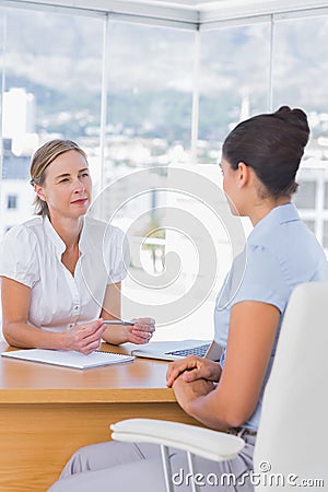 Interviewer and interviewee talking together Stock Photo