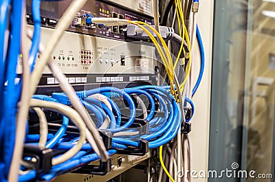 Interweaving of the Internet wires in the server room of the data center.Cabling in the server rack Stock Photo