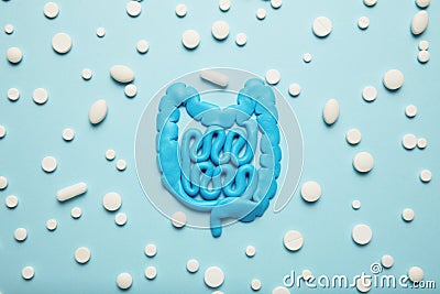 Intestines and pills, probiotics, antibiotics. Gut protection, recovery from illness and treatment Stock Photo