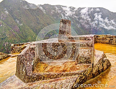 Intihuatana stone as an astronomic clock or calendar by the Incas in Machu Picchu archaeological siteCuzco, Peru Stock Photo