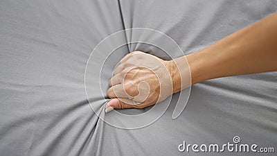 Intimate expression of passion, a woman\'s hands, rising waves of orgasm on a cozy bedroom bed Stock Photo