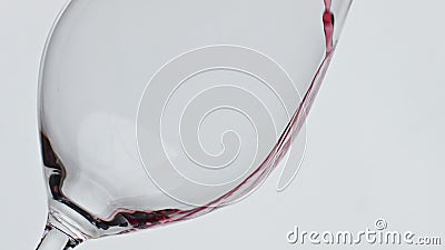 Intoxicant beverage filling goblet slow motion. Pouring alcoholic liquid glass Stock Photo