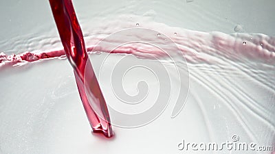 Intoxicant red beverage filling goblet. Pouring alcoholic liquid clean wineglass Stock Photo