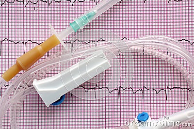 Intravenous system on surface of electrocardiogram Stock Photo