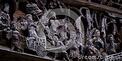 Intricate carving on the wooden exterior of a building in Huangling, Wuyuan, Jiangxi Stock Photo