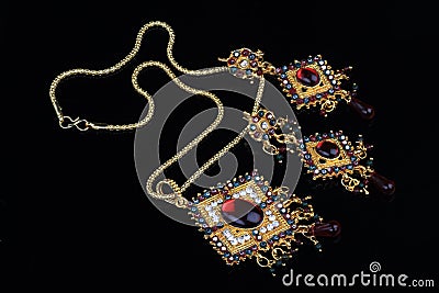 Intricate Indian Gold Jewelry On Black Background Stock Photo