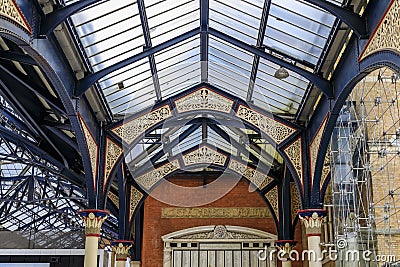 Intricate ironwork decorative roof trusses details at the Liverpool Train Station in London, United Kingdom Stock Photo