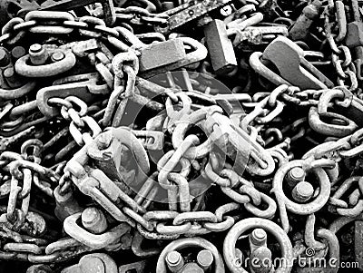 An intricate pattern of locks and chains indicating the suffocating effects of the prison of judgement and segregation Stock Photo