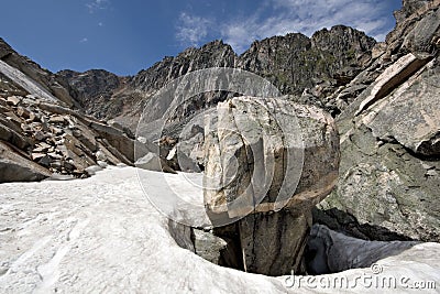 Intricate rock among snow, Sayan mountains. Siberia Stock Photo