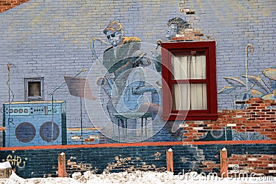 Intricate street art of musicians and their instruments on old brick wall in Winter, Saratoga Springs,New York,2015 Editorial Stock Photo