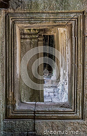 Carved stone window with pillar and corridor in Temple Siam Reap Cambodia Stock Photo