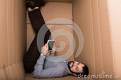 introvert using digital tablet with html code Editorial Stock Photo