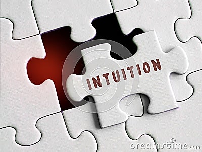 Intuition text on a puzzle Stock Photo