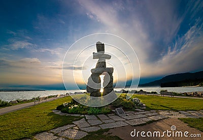 Inukshuk Vancouver in the evening with sunset and great cloud formation Stock Photo