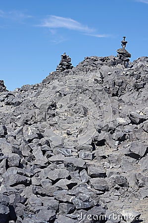 Inukshuks on top of Black Tusk mountain Stock Photo