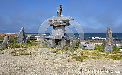 Inuksuk at the shore of the Hudson Bay. Stock Photo