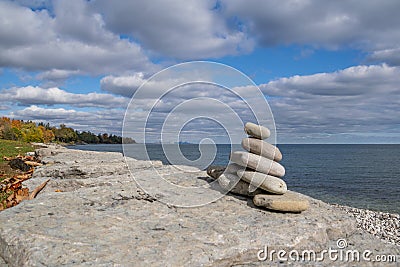 Inuksuk on the Shore of Lake Ontario Stock Photo