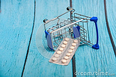 Inverted trolley and pills and medicines lie nearby, the concept of the uselessness and futility of treatment Stock Photo