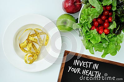 Invest in your health , Healthy lifestyle concept with diet and fitness , Get fit in , fitness equipment and healthy food Stock Photo