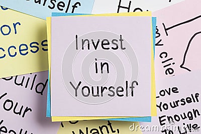 Invest in Yourself written on a note Stock Photo