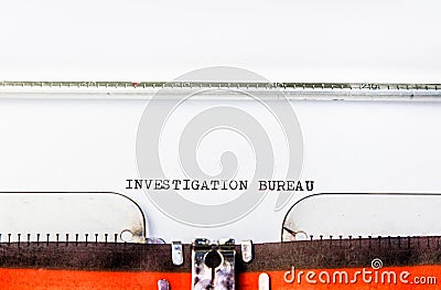 Investigation bureau text on typewriter Stock Photo