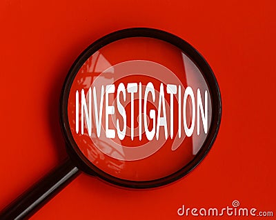 Investigation text on red cover with magnifying glass. Scamming and fraud concept Stock Photo