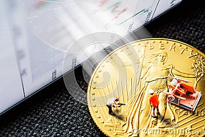 Investing in golden coins Stock Photo