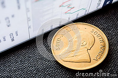 Investing in golden coins Stock Photo