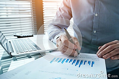 Investor analyzing finance estimation charts, financial analytics Stock Photo