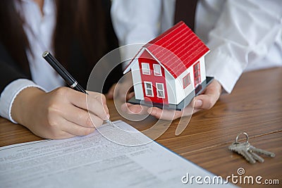 Investors signed a contract, Buying and selling real estate. Property investment and house mortgage financial concept Stock Photo