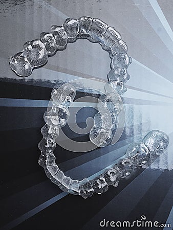 Invisible dental teeth brackets tooth aligners plastic braces retainers to straighten teeth. Orthodontic temporary Stock Photo