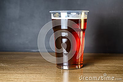 Invitation to a student beer party. A glass of cheap craft beer Stock Photo