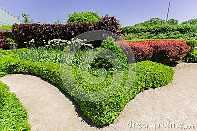 Inviting beautiful view of botanical garden landscape on sunny spring day Stock Photo