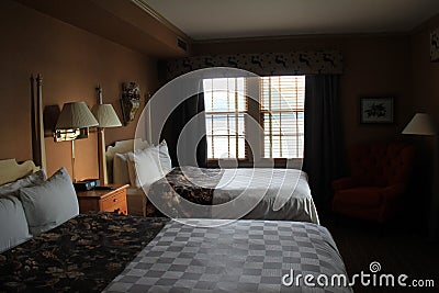 Inviting suite with comfortable beds and decorations, The Sagamore Resort, Bolton Landing, NY, 2016 Editorial Stock Photo