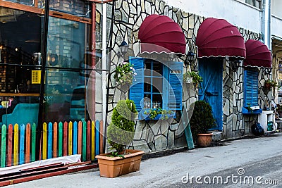 Vintage Restaurant Window With Colorful Shutters And Umbrella Editorial Stock Photo