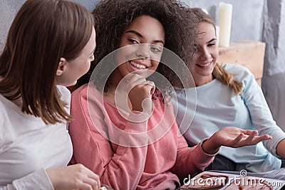 Involved young girls share opinions at home Stock Photo