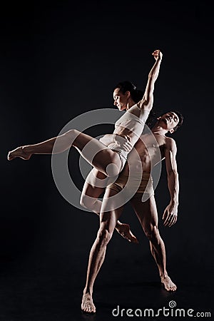 Involved young gymnasts having the common rehearsal Stock Photo
