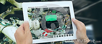 Iot industry 4.0 concept,industrial engineer using software augmented, virtual reality in tablet to monitoring machine in real t Stock Photo