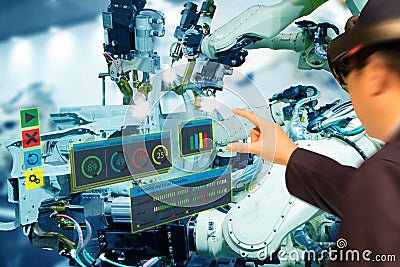 Iot industry 4.0 concept,industrial engineerblurred using smart glasses with augmented mixed with virtual reality technology to Stock Photo