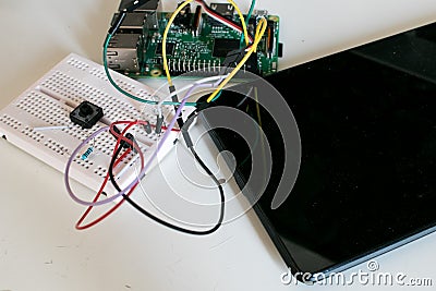 IoT prototype circuit with single board connected to a tablet Stock Photo