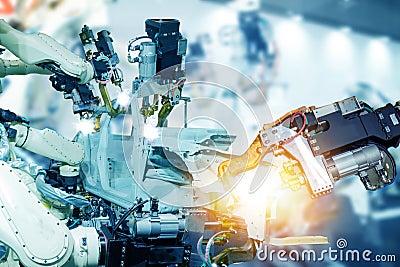 Iot smart factory , industry 4.0 technology concept, robot arm in automation factory background with fake sunlight on operation li Stock Photo