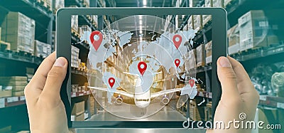 iot smart retail in the futuristic concept, the retailer hold the tablet and use augmented reality technology monitor data of out Stock Photo