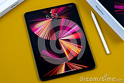 IPad Pro 11-inch 2021 model with Apple M1 chip and an Apple pencil. Editorial Stock Photo