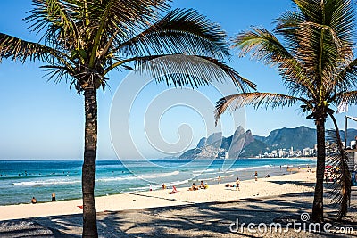 Ipanema Beach and front street with palms and mosaic of sidewalk Editorial Stock Photo