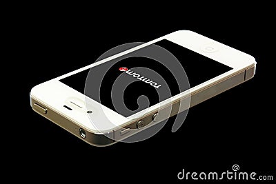 IPhone white with Tom Tom on black background Editorial Stock Photo