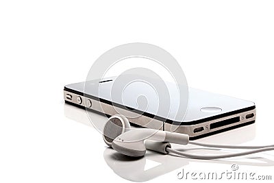 Iphone 4S and earphones Editorial Stock Photo