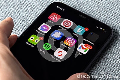 Iphone with different apps icons for social media and productivity Editorial Stock Photo