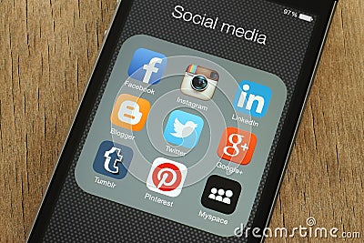 iPhone with popular social media icons on its screen Editorial Stock Photo